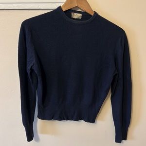 Navy blue 100% imported cashmere sweater. I believe it’s a xsmall!